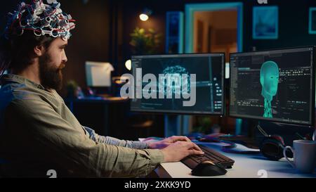 Developer using EEG headset device to upload his brain into computer, attaining immortality. Neuroscientist runs experiment, transfers consciousness into cyberspace, transhumanism concept, camera B Stock Photo