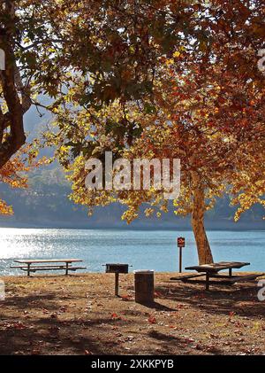 picnic tables next to lake at Lake Del Valle in California Stock Photo