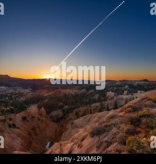 Time-lapse image of the entire sequence of an annular solar eclipse of the Sun on 14 October 2023. Photographed from Bryce Canyon, Utah, USA. Stock Photo