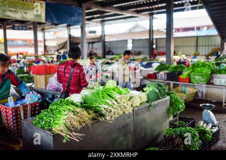 Wide range of green vegetables at market in Lijiang, China Stock Photo