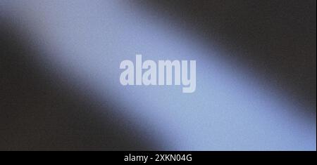 Diagonal light beam illuminating a grainy textured surface, creating a gradient effect Stock Photo