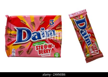 Pack of limited edition Daim Strawberry flavoured chocolate bars with one bar removed from wrapper isolated on white background Stock Photo