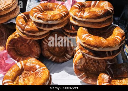 traditional Uzbek tandoor flat bread on the counter at the bazaar in Uzbekistan Stock Photo