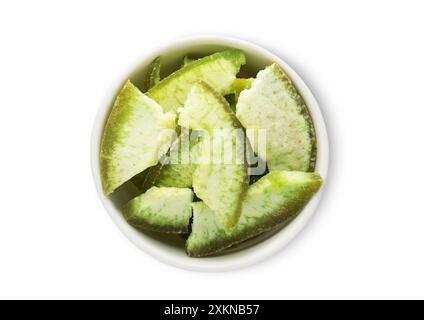 Bowl with dried green grapefruit slices isolated on white background. Stock Photo