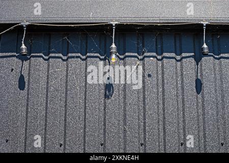 interactive economical light bulbs on the street on a sunny day. electricity crisis Stock Photo