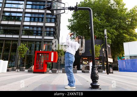 EDITORIAL USE ONLY An art installation of a folded lamppost, bench and telephone box by Jem Hughes at Old Street, London, commissioned by Samsung. Picture date: Wednesday 24th July 2024. The art installation forms a part of a wider art project, Fold Town, by Samsung to mark the release of the Galaxy Z Flip6 and Z Fold6, now with Galaxy AI technology. Photo credit should read: David Parry/PA Media Assignments Stock Photo