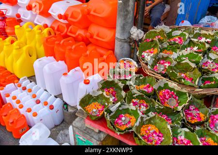 Different types of plastic cans are available to carry Ganga water in Haridwar. Stock Photo