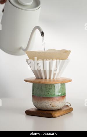 Artful pour-over coffee method captured mid-drip, showcasing the meticulous process of handcrafted brewing. Stock Photo
