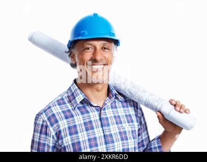Portrait, architect and happy man with blueprint in studio for building floor plan isolated on white background. Face, mature engineer or construction Stock Photo
