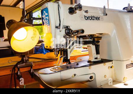 A  brother industrial sewing machine is ready to sew heavy fabric in a workshop in Durango, Colorado Stock Photo