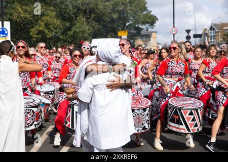 Performers are seen as they participate in Adult's Parade of the Notting Hill Carnival in west London. Stock Photo