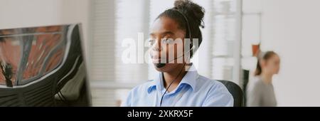 Website header of African American female worker plunged into work process in cozy office Stock Photo