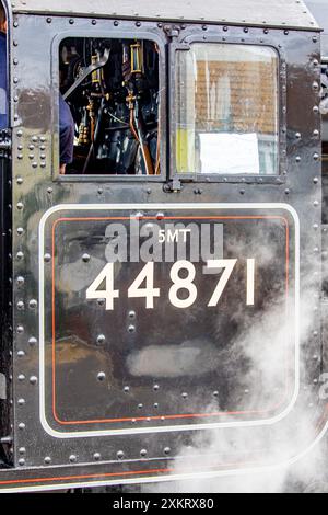 Weymouth, Dorset, UK, 24th July 2024. Exterior view of the cockpit showing the locomotive No. 44871. Driven by Andy Hawkins, it arrived in Weymouth today Wednesday, July 24, 2024 from London Victoria via Bournemouth, Poole, Wareham and Dorchester.  The Dorset Coast Express train, operated by the Railway Touring Company, gives visitors almost three and a half hours in Weymouth to discover this lovely traditional seaside town. Credit John Rose Photography/Alamy Live News Stock Photo