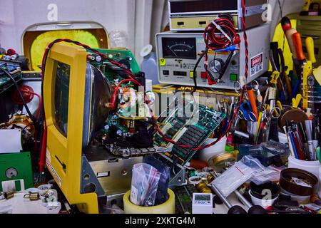 CRT Monitor with Digital Oscilloscope and Tools in Electronics Workshop Stock Photo