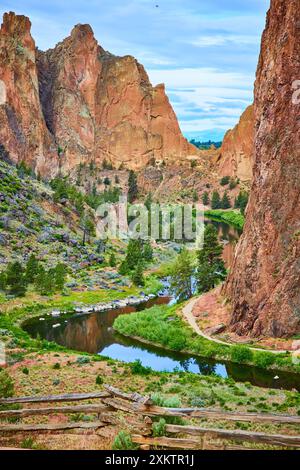 Smith Rock Cliffs and River with Wooden Fence from Elevated View Stock Photo