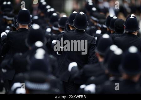 File photo dated 21/04/17 of New Metropolitan Police officers during their passing-out parade at the Police Academy in Hendon, London. Record numbers of police officers in England and Wales are quitting their jobs or being sacked, figures show, and in the year to March, 5,151 officers left after a voluntary resignation. Issue date: Wednesday July 24, 2024. Stock Photo