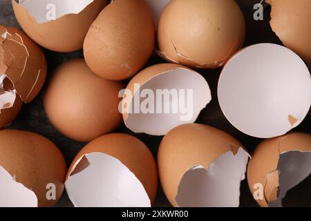 Pieces of broken eggshells on table, top view Stock Photo