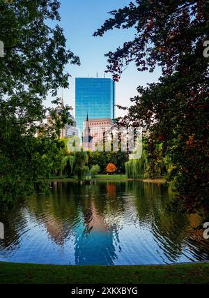Boston, Massachusetts, USA - October 15, 2022: A view across the Boston Public Garden pond during an autumn sunrise. Stock Photo