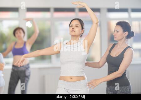 Ballet lesson for amateurs - choreographer teaches women of different ...