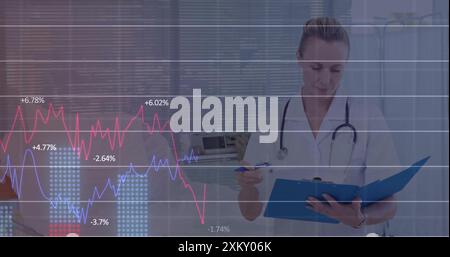Image of financial data processing over caucasian female doctor in hospital Stock Photo