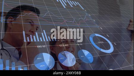 Image of financial data processing over diverse doctors in hospital. Global medicine, healthcare, connections, computing and data processing concept d Stock Photo