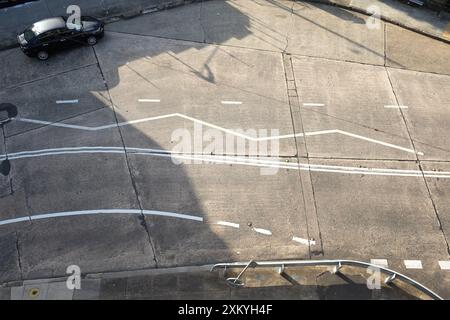 Plan view of the pathwork of concrete slabs and an array of white lines on a, Inner West roadway in Dulwich Hill, Sydney in afternoon sun Stock Photo