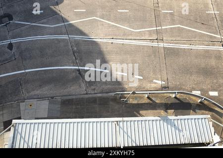 Plan view of the pathwork of concrete slabs and an array of white lines on a, Inner West roadway in Dulwich Hill, Sydney in afternoon sun Stock Photo