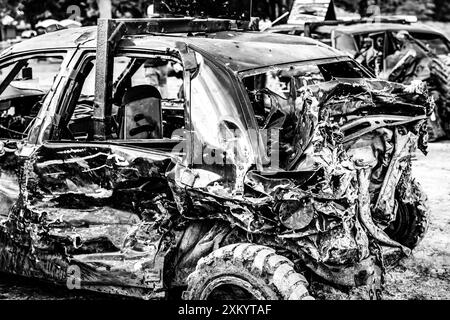 Dented and damaged rear end of a modified car used for a demolition ...