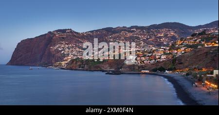 Funchal city at night  in Madeira near black Formosa beach, Portugal Stock Photo