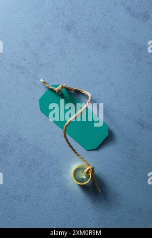 Label attached to a gold ring. Stock Photo