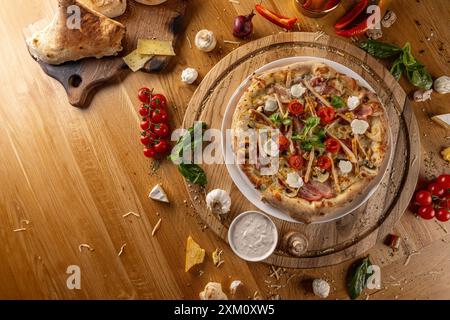 Artisan wood fired pizza on rustic wooden board with space for your text Stock Photo