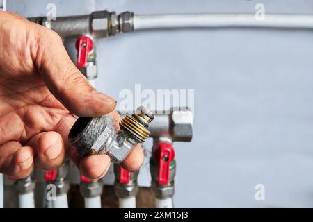 Metal corner fitting for plastic pipes with crimp connection and transition to an external thread. Stock Photo
