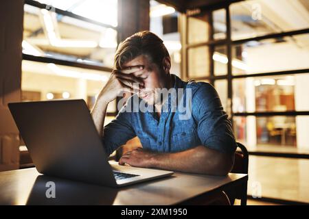 Business man, laptop and tired with headache for difficult project, software glitch and burnout in office. Programmer, computer and migraine for Stock Photo