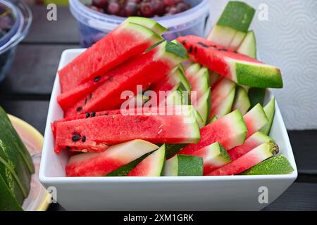 diced watermelon in a fruit plate.fresh sliced watermelon on a plate Stock Photo