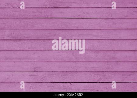 Distressed cracked wooden plank texture background. Wood weathered wall pink surface, painted wooden panels, wallpaper, backdrop, design element. Stock Photo