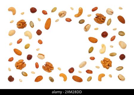 Background from various circle shaped nuts and seeds with copy space for text. Isolated on white background. Flat lay, top view Stock Photo