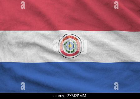 Paraguay flag depicted on folded wavy fabric of old cloth close up Stock Photo