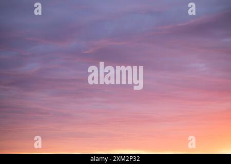 Sunrise sky above a city. Incredible natural colors. Red, orange, purple, dark blue. Heaven. Stock Photo