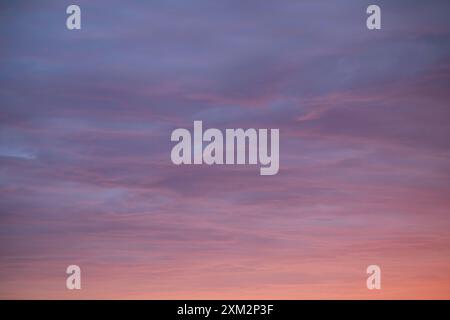 Sunrise sky above a city. Incredible natural colors. Red, orange, purple, dark blue. Heaven. Stock Photo
