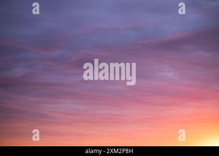 Sunrise sky above a city. Incredible natural colors. Red, orange, purple, dark blue. Heaven. Stock Photo