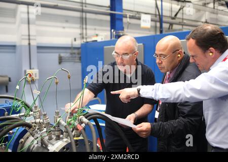 Kazakh Pavlodar refinery chief mechanic (centre) visiting British engineers and comressor specialists at John Crane in Slough Stock Photo