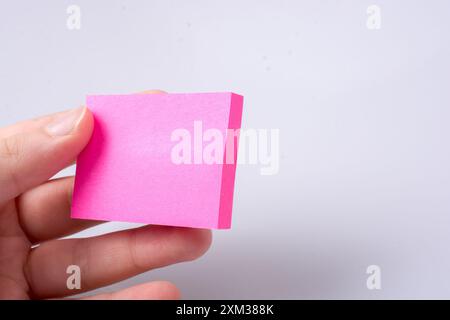 Post note office sticker for taking notes in hand Stock Photo