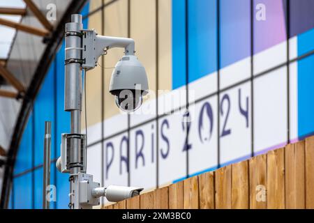 Video surveillance camera in front of a venue of the Paris 2024 Summer Olympic Games. Concept of digital and algorithmic surveillance Stock Photo