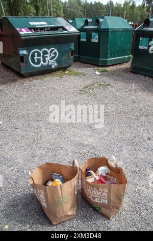 Two bags of garbage are waiting to be sorted for recycling at the recycling station in Malmköping, Sweden. Stock Photo
