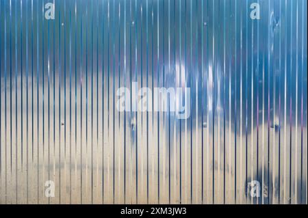 Corrugated striped metal sheet industrial warehouse texture background Stock Photo