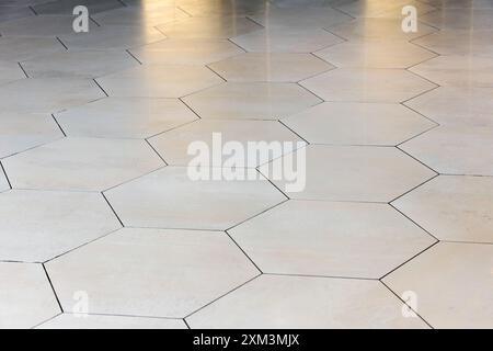 White room pavement made of glossy white hexagonal tiles, background photo Stock Photo