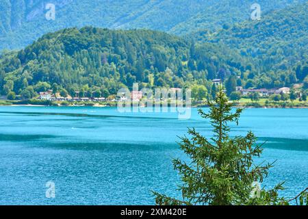 Lago di Ledro, Italy - July 21, 2024: Lago di Ledro in Italy, surrounded by lush vegetation and the impressive Italian Alps *** Lago di Ledro in Italien, umgeben von üppiger Vegetation und den beeindruckenden italienischen Alpen Stock Photo