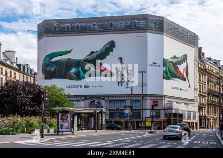 Advertising billboards for Lacoste over a building in Paris France. Lacoste is a French luxury sports fashion company with a green crocodile logo Stock Photo Alamy