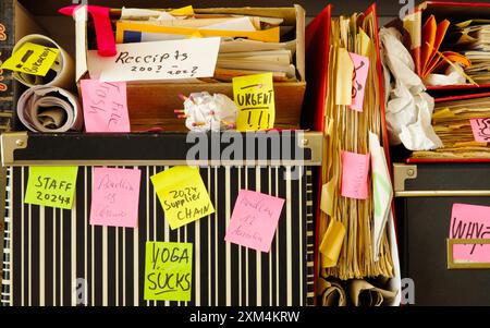 Messy file folder,sticky notes and old papers.Red tape, bureaucracy ...