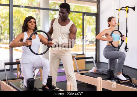 Positive African American man coach helping woman Stock Photo